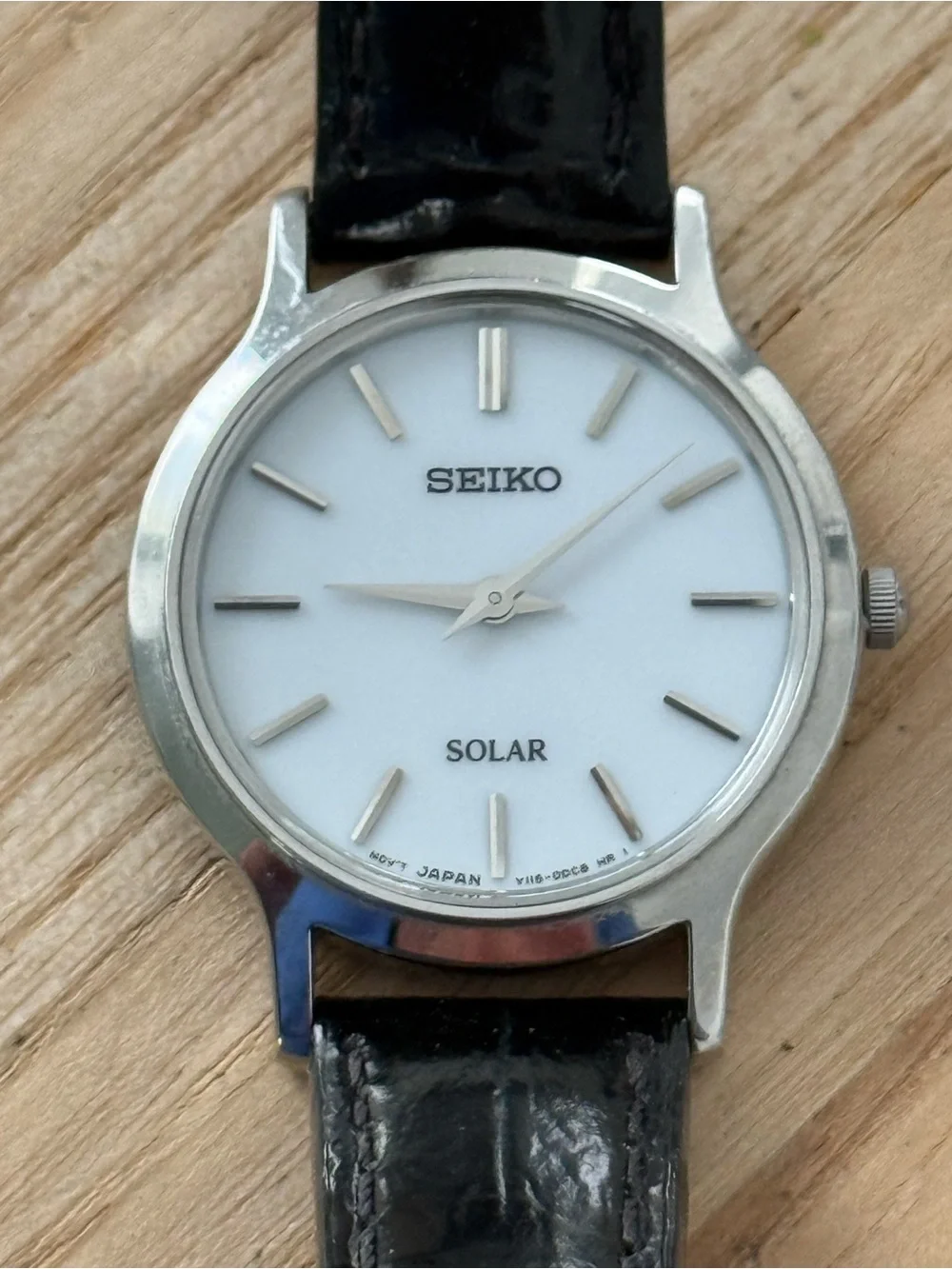 Seiko Solar Ladies Watch White Round Dial Black Leather Strap Stainless Case
